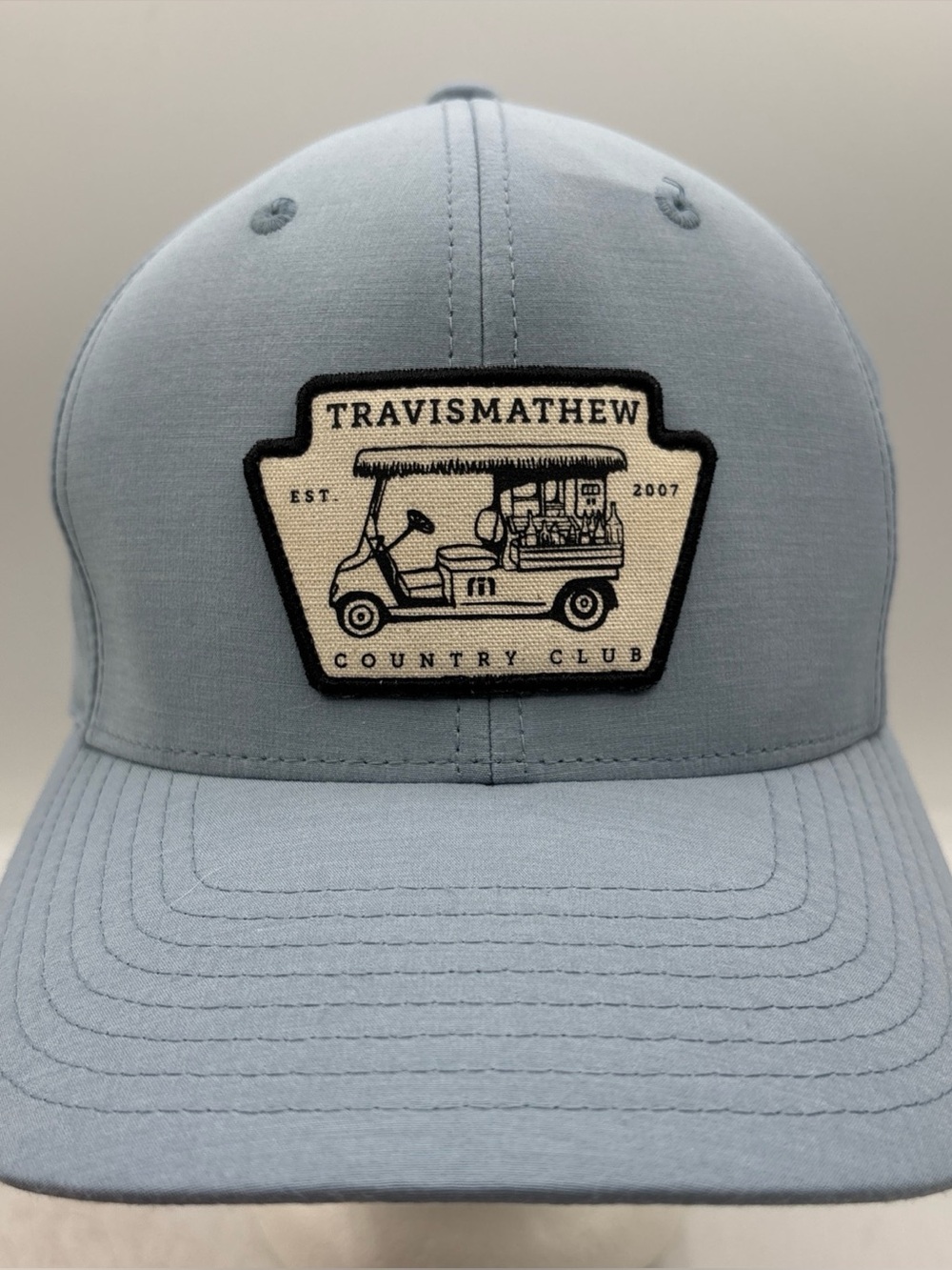 TravisMathew Tiki Mapes Patch Golf Hat Light Blue Flexfit 110 SnapBack Cap OSFM